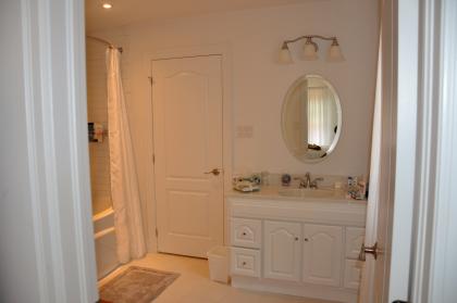 The large ensuite bathroom has a soaker tub and shower.
